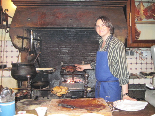 Roasting the meats at La Tupina over hot wood-burning coals.